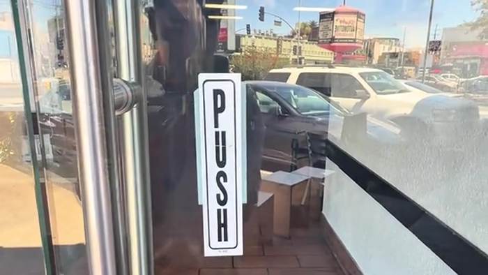 The glass front door on Melrose, seen from inside.